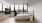 a bedroom with a large window and a tv